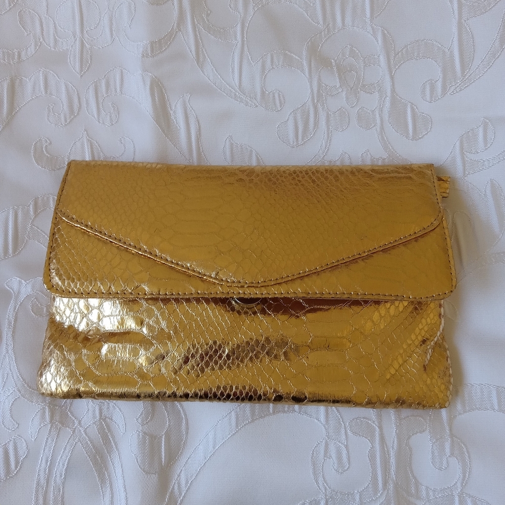 Metallic gold color clutch bag